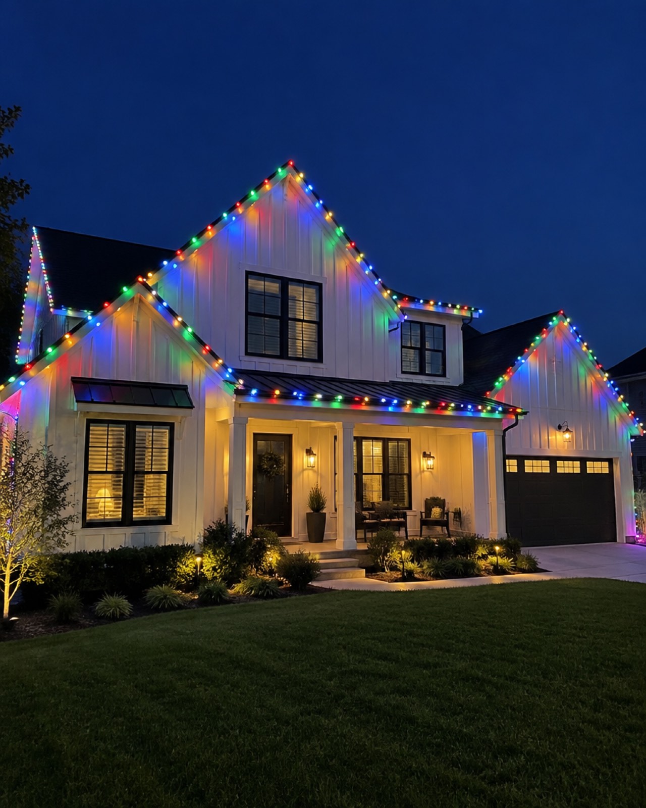 White farmhouse-style home in Irvine outlined in multicolor C9 Christmas lights